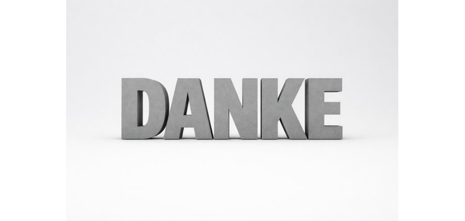 Auf dem Bild ist das Wort Danke in der Farbe grau und in 3D abgebildet 