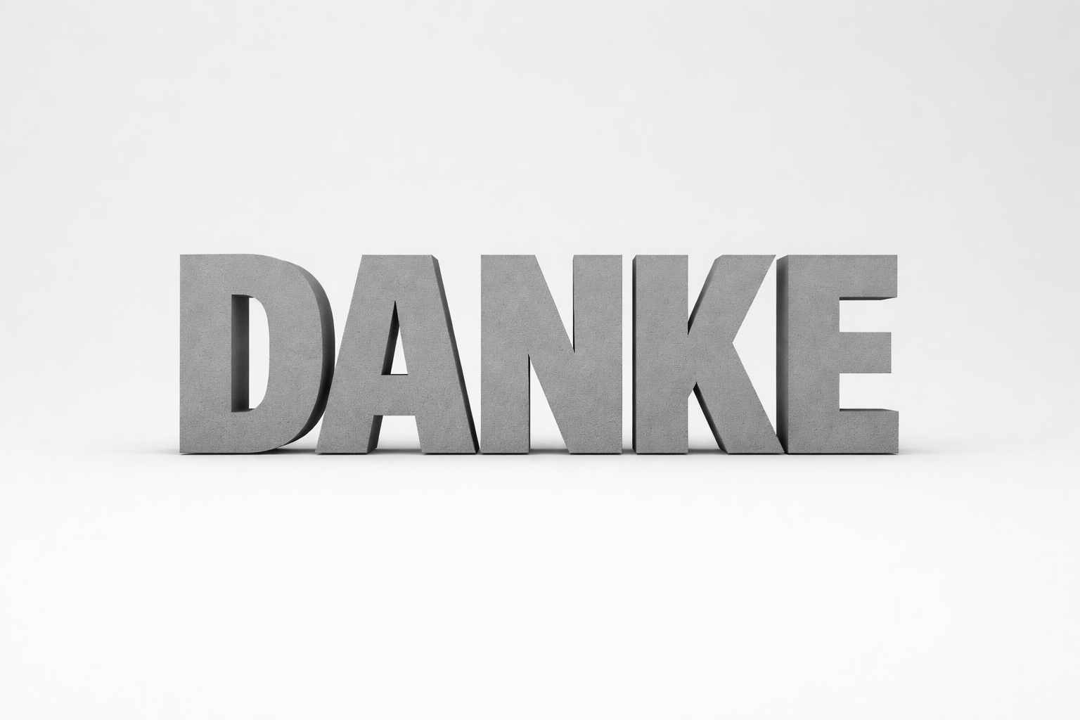 Auf dem Bild ist das Wort Danke in der Farbe grau und in 3D abgebildet 